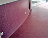 Instalación de pavimentos de PVC en rollo con terminación a media caña y remate superior.